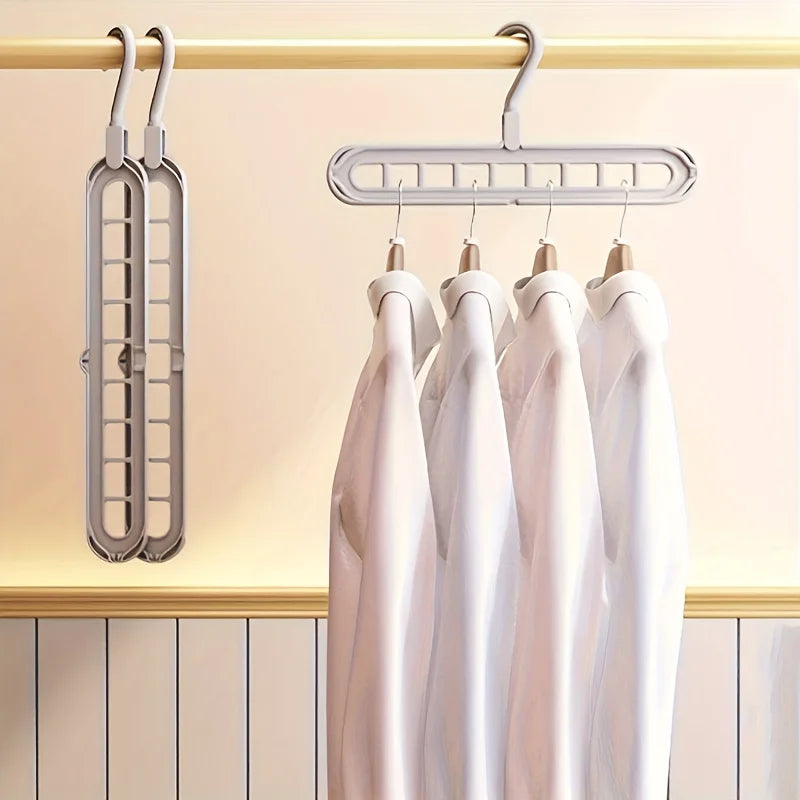 Magic 9-Hole Foldable Clothes Hanger – Space Saver Metal Organizer with 360° Rotating Hook 🌀